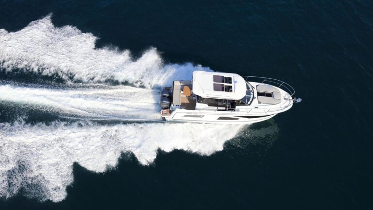 Aerial view of a Jeanneau NC1095 cruising on the water